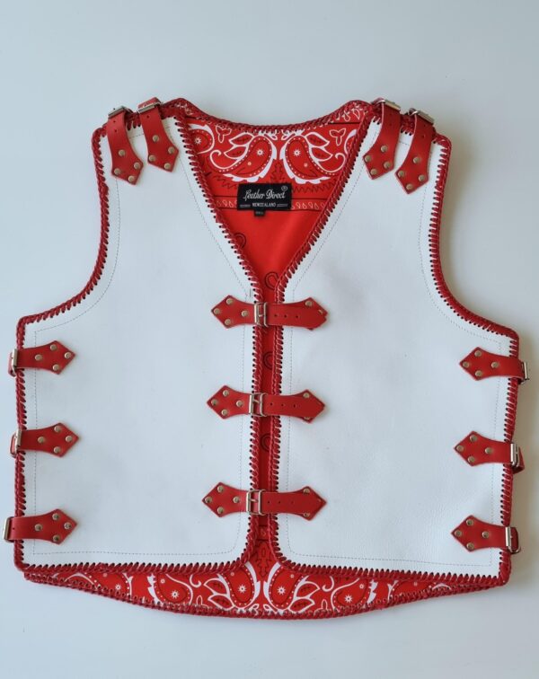 White leather vest with red straps